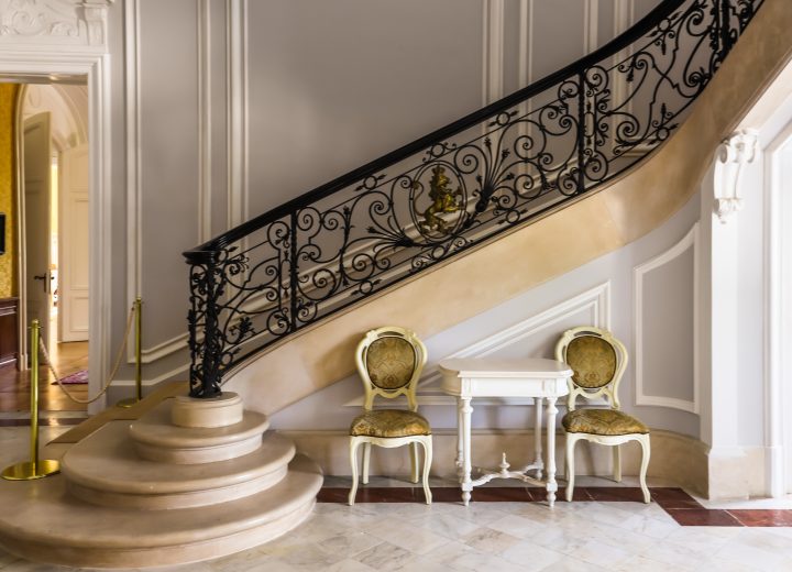 Wrought iron staircase railing with scrollwork