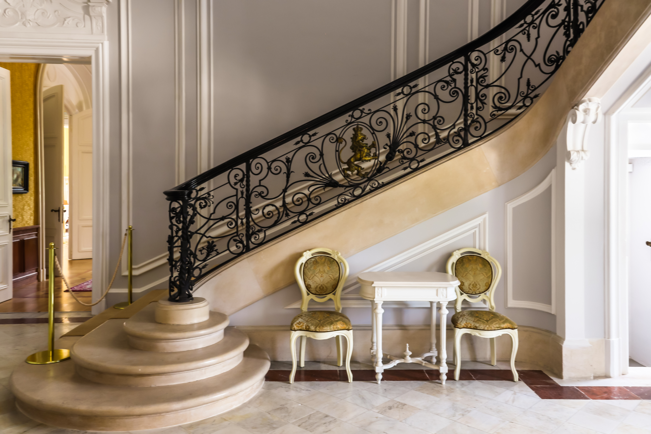 Wrought iron staircase railing with scrollwork