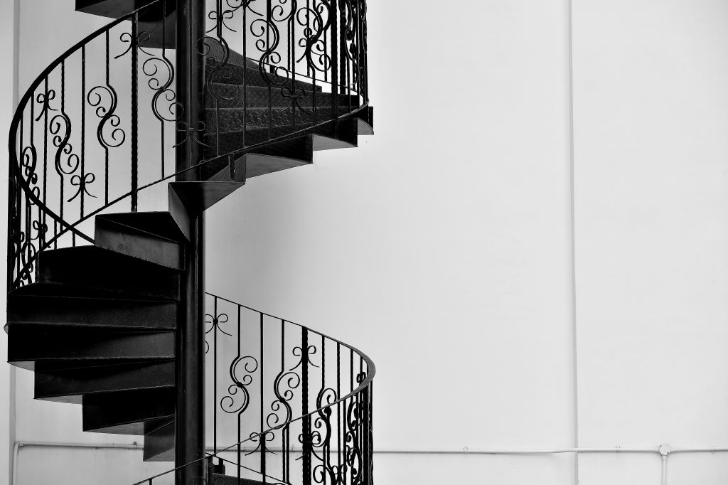 Custom iron railing on a spiral staircase