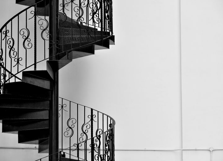 Custom iron railing on a spiral staircase
