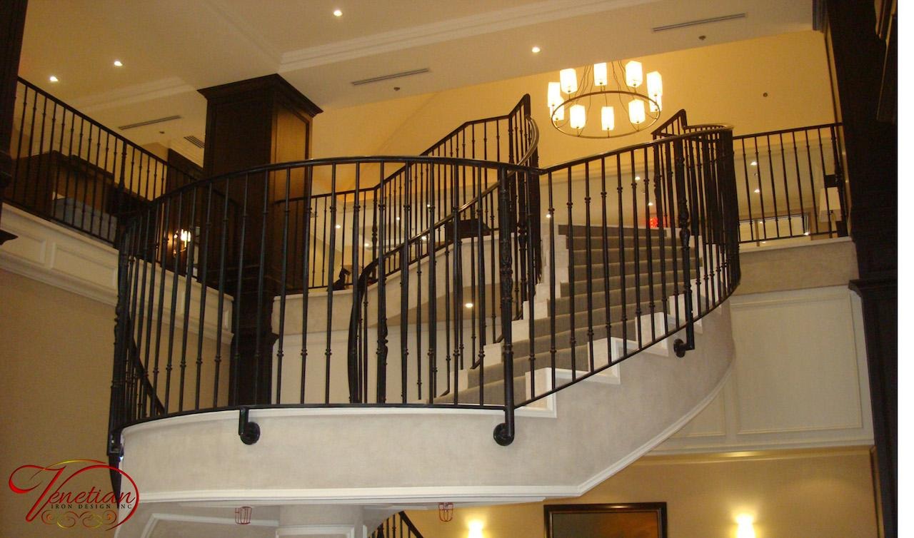 Wrought iron entrance canopy over a panelled front door