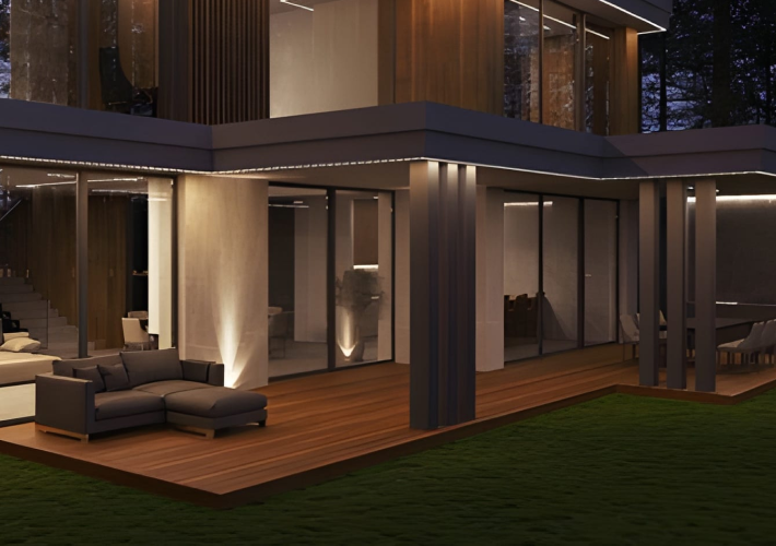 Modern home terrace with aluminium and glass railings at night
