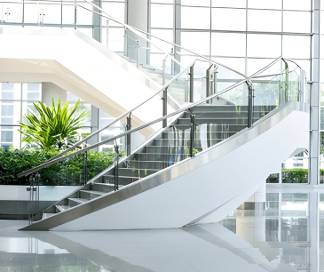 Curved staircase with a glass balustrade
